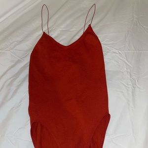 Urban Outfitters ribbed bodysuit, never worn, size M. Rusty red color.